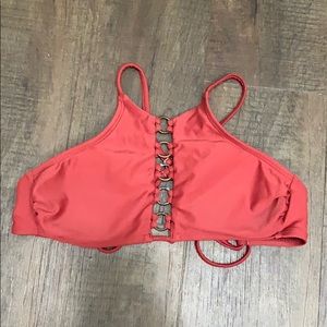 A rust colored bathing suit top.